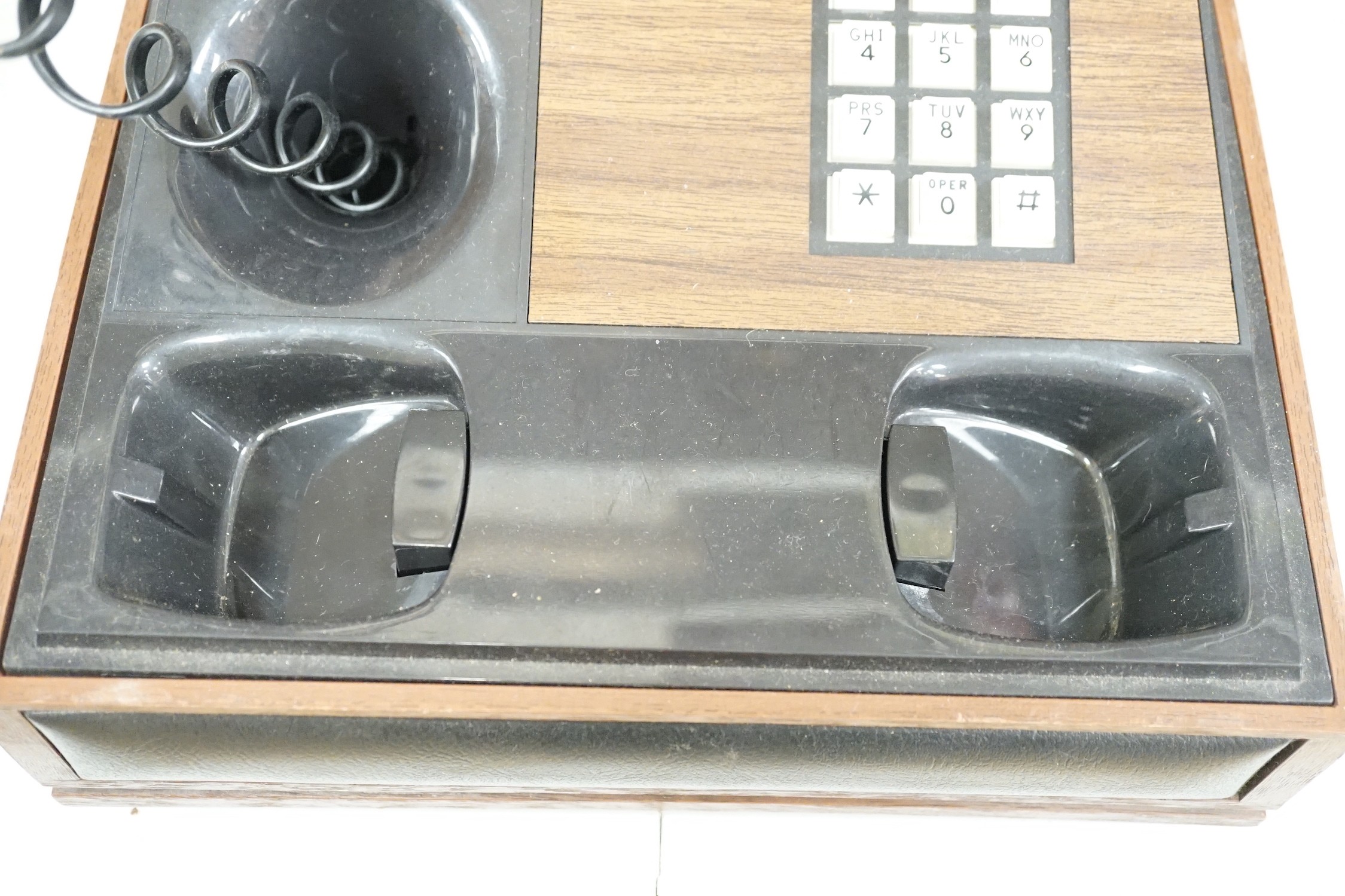 A Deco-Tel personal telephone set in hinged case